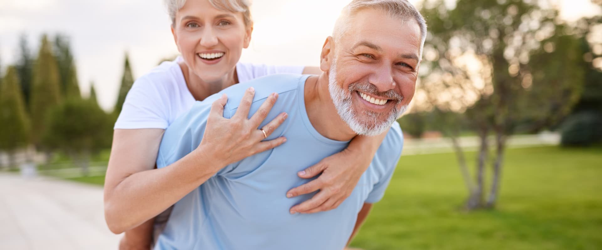 man giving his wife a piggy back