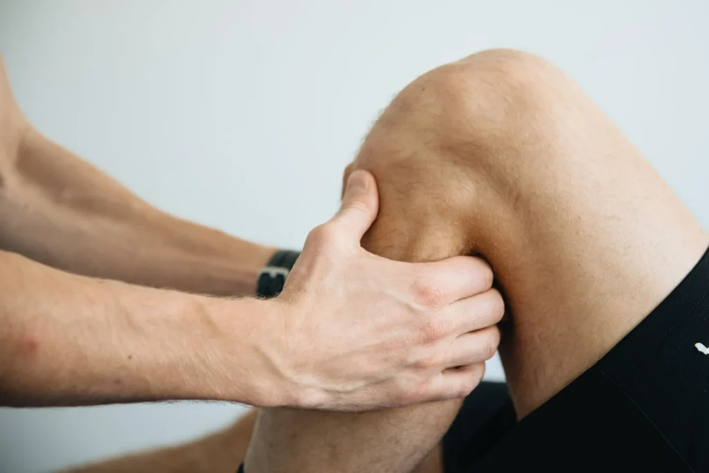 What Is Runner’s Knee? Symptoms, Causes and Treatment 1 Physiotherapist examining a patient’s knee during a clinical assessment.