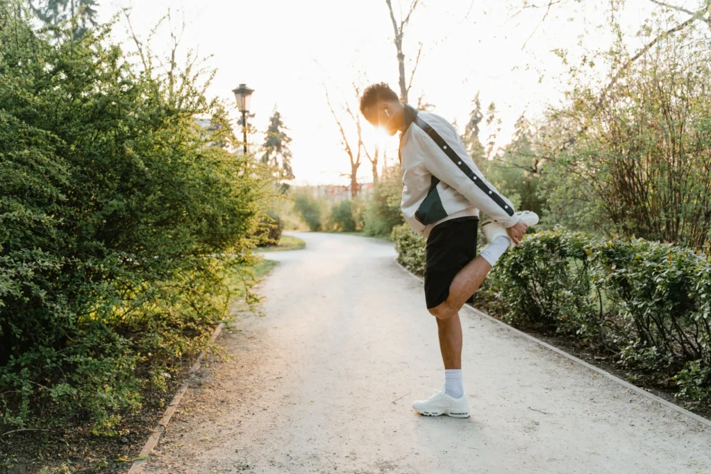 Man stretching outdoors as part of an active lifestyle.